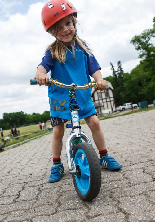MIKE DEAL / WINNIPEG FREE PRESS
Student Logan Wintoniw, 3, who is in the Laura Secord Flaming Cheetahs Bike Club ride custom built bikes at an interactive demonstration during the Green Action Centres Clean Air Day event held at Assiniboine Park to celebrate clean air and green transportation during National Environmental Week in Canada. 
170607 - Wednesday, June 07, 2017.