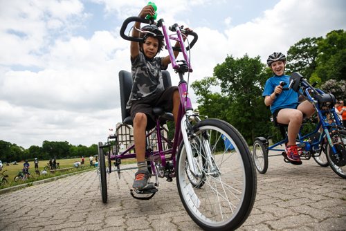 MIKE DEAL / WINNIPEG FREE PRESS
Students Paihyin Swan-Nault, 9, and Hannah Wintoniw (right),10 who are in the Laura Secord Flaming Cheetahs Bike Club ride custom built bikes at an interactive demonstration during the Green Action Centres Clean Air Day event held at Assiniboine Park to celebrate clean air and green transportation during National Environmental Week in Canada. 
170607 - Wednesday, June 07, 2017.