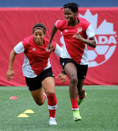 PHIL HOSSACK / WINNIPEG FREE PRESS  -  TWO OF THREE -Team Canada's Desiree Scott (left) tries to go stride for stride with a longer legged Kadeisha Buchanan practice at Investors Group Field Wednesday.  See Jason Bell's story.  -  June 7, 2017