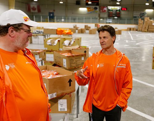 JUSTIN SAMANSKI-LANGILLE / WINNIPEG FREE PRESS
Canada Games CEO Jeff Hnatiuk talks about the upcoming games while sporting the new volunteer uniforms with Free Press columnist Doug Speirs Thursday, at the Canada Games accreditation and volunteer centre.
170608 - Thursday, June 08, 2017.