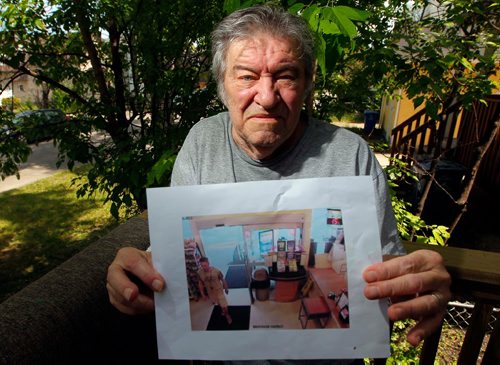 BORIS MINKEVICH / WINNIPEG FREE PRESS
Senior citizen Dan Tokash had his wallet containing $600, all his ID, and important medical information for his disabled wife stolen by a bad samaritan. Dan unknowingly dropped it in the IGA in Maples on Jefferson on Monday morning. Here he holds the security photo of the person that allegedly walked away with it.  ASHLEY PREST STORY. June 8, 2017
