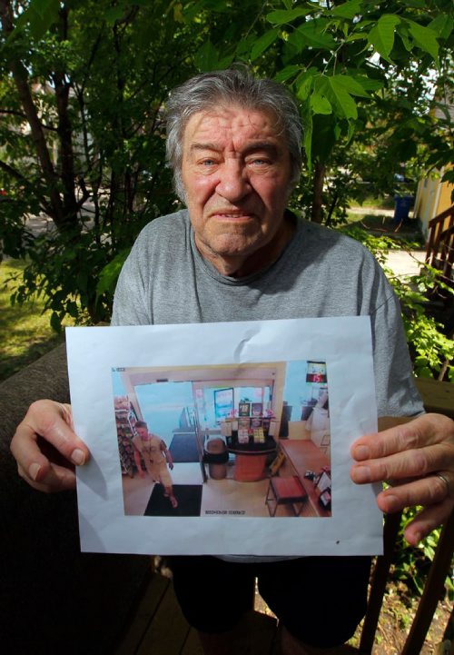BORIS MINKEVICH / WINNIPEG FREE PRESS
Senior citizen Dan Tokash had his wallet containing $600, all his ID, and important medical information for his disabled wife stolen by a bad samaritan. Dan unknowingly dropped it in the IGA in Maples on Jefferson on Monday morning. Here he holds the security photo of the person that allegedly walked away with it.  ASHLEY PREST STORY. June 8, 2017

