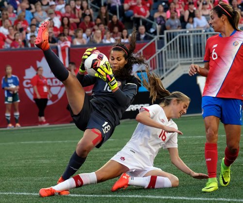 PHIL HOSSACK / WINNIPEG FREE PRESS  -   SERIES OF THREE IMAGES - Team Costa Rica netminder #18 Noelia Bermudez snatches the ball away from Canada's #16 Janine Beckie in a collision in front of the Costa Rica net Thursday night at Investor's Group Field. Costa RIca #6 Carol Snachez watches. See story.  -  June 8 2017 SERIES OF THREE IMAGES