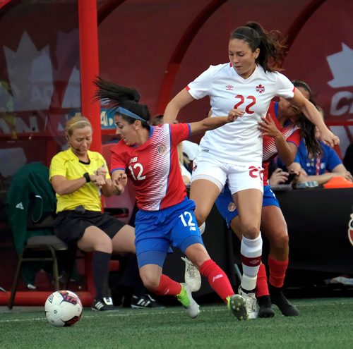 PHIL HOSSACK / WINNIPEG FREE PRESS  -   Team Canada's #22Lindsay Agnew and Costa Rica's #12 Lixy Rodriguez figt for the ball Thursday night at Investor's Group Field. See story.  -  June 8 2017