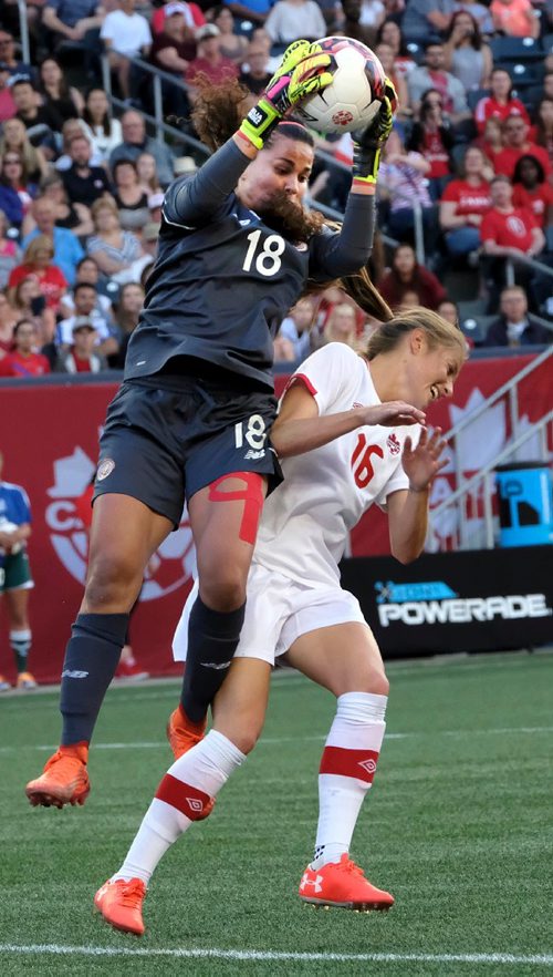 PHIL HOSSACK / WINNIPEG FREE PRESS  -   Team Costa Rica netminder #18 Noelia Bermudez snatches the ball away from Canada's #16 Janine Beckie in a collision in front of the Costa Rica net Thursday night at Investor's Group Field. See story.  -  June 8 2017