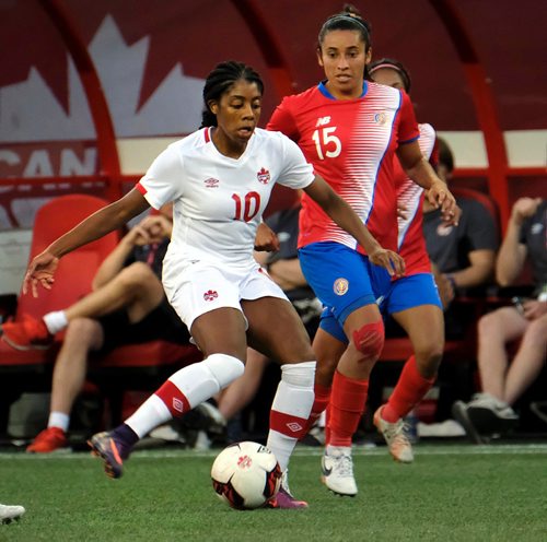 PHIL HOSSACK / WINNIPEG FREE PRESS  -   Team Canada's #10 Ashley Lawrence works the ball around Costa Rica's #15Cristin Granados Thursday night at Investor's Group Field. See story.  -  June 8 2017