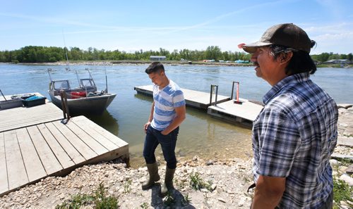 WAYNE GLOWACKI / WINNIPEG FREE PRESS

Dauphin River First Nation members and commercial fishermen Terry Stagg with ball cap and his son Daniel Stagg with their fishing boat docked near Lake Winnipeg along the Dauphin River.   They were interviewed for Bill Redekop story. June 9  2017