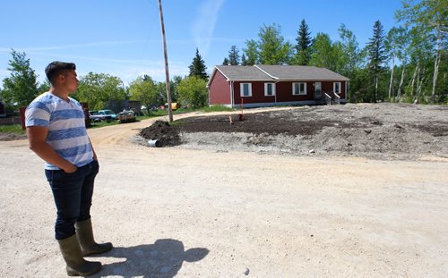 WAYNE GLOWACKI / WINNIPEG FREE PRESS

Dauphin River First Nation member Daniel Stagg by a new home across the road from his familys home. This is one of the many new homes in the community since the flood.  Bill Redekop story. June 9  2017