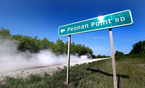 WAYNE GLOWACKI / WINNIPEG FREE PRESS

The road sign on Highway #328 points south to Peonan Point, a peninsula in the northern part of Lake Manitoba.    Bill Redekop story. June 9  2017