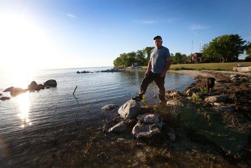 WAYNE GLOWACKI / WINNIPEG FREE PRESS

Dave Olson lives in Peonan Point, a peninsula in the northern part of Lake Manitoba. He is standing along the lake by the family home.    Bill Redekop story. June 9  2017