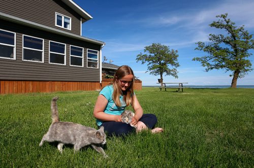 WAYNE GLOWACKI / WINNIPEG FREE PRESS

Morgan Olson,14, at home with her cats in Peonan Point, Mb. along Lake Manitoba.   Bill Redekop story. June 9  2017
