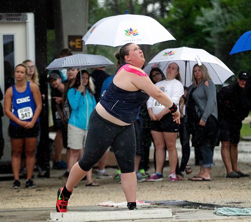 PHIL HOSSACK / WINNIPEG FREE PRESS  -  Taylor Heald didn't let the rain stop her Friday. The Grant Park Pirate watches the throw that tied the record in shot put. See story.   -  June 9, 2017