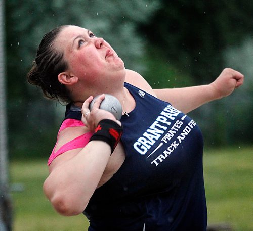 PHIL HOSSACK / WINNIPEG FREE PRESS  -  Taylor Heald didn't let the rain stop her Friday. The Grant Park Pirate tied the record in shot put. See story.   -  June 9, 2017
