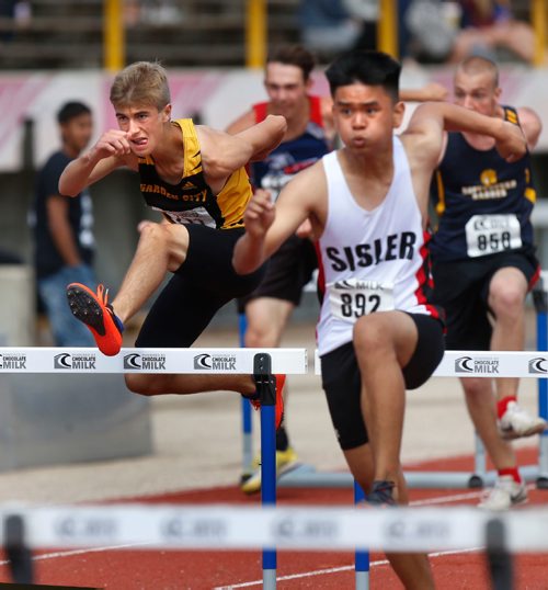 WAYNE GLOWACKI / WINNIPEG FREE PRESS

At right, Michael Silverie from Sisler High School and Connor Klassen,left, from Garden City Collegiate competing in the  Junior Varsity Boys 100 meter hurdles event at the 2017 Provincial High School Milk Track and Field Championship at the University of Manitoba Stadium Saturday.   ¤For Taylor Allen story. June 10   2017