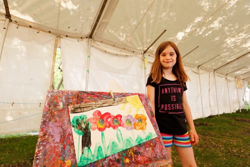 JUSTIN SAMANSKI-LANGILLE / WINNIPEG FREE PRESS
Young artist Annika poses with her completed masterpiece at the arts and crafts tent Saturday as part of the 35th annual Kidsfest at The Forks.
170610 - Saturday, June 10, 2017.