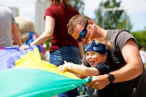 JUSTIN SAMANSKI-LANGILLE / WINNIPEG FREE PRESS
Oliver and his dad Patrick Labossiere play with a giant parachute Saturday during the 35th annual Kidsdfest at The Forks.
170610 - Saturday, June 10, 2017.