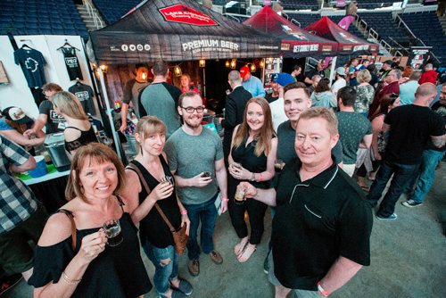 JUSTIN SAMANSKI-LANGILLE / WINNIPEG FREE PRESS
Festival goers pose infront of one of 80 individual booths at this year's Flatlander's Beer Festival. Over 250 beers and ciders from around the world are available at this years festival.
170610 - Saturday, June 10, 2017.