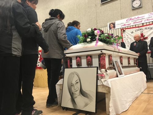 MELISSA MARTIN / WINNIPEG FREE PRESS
The people of Bunibonibee Cree Nation file past Christine Woods casket, as the community gathered at the local elementary school on Saturday, June 10, 2017 to lay her to rest. 
