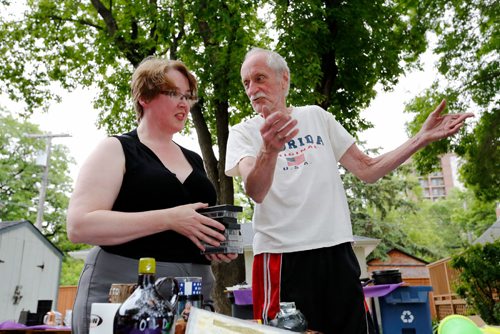 JUSTIN SAMANSKI-LANGILLE / WINNIPEG FREE PRESS
Lisa Boland, a 30 year garage sale veteran talks prices with Lorne Jennings, the owner of this garage sale. There are garage sales popping up around the city all the time and you never know what treasures you might find.
170609 - Friday, June 09, 2017.