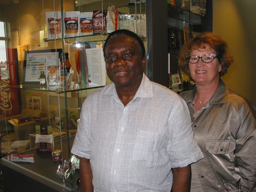 Canstar Community News May 25, 2017 - Food Development Centre research and development manager Alphonsus Utioh and business development managerRoberta Irvine stand next to a display case showing food products developed by centre customers. (ANDREA GEARY/CANSTAR COMMUNITY NEWS)