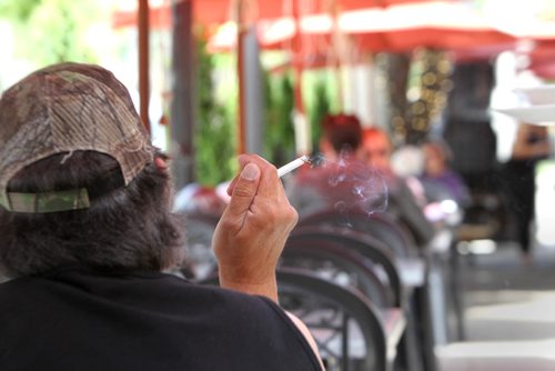 RUTH BONNEVILLE / WINNIPEG FREE PRESS

A person smokes a cigarette on a patio on Corydon Ave. Monday.  For story on new smoking ban coming for all patios in the city.  
See story. 

June 12, 2017