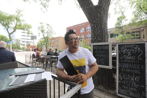 RUTH BONNEVILLE / WINNIPEG FREE PRESS

Charles Garcia, manager at Teo's restaurant on Corydon,, comments on new smoking ban on patios Monday.  

June 12, 2017