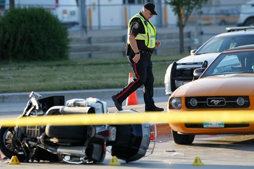 JOHN WOODS / WINNIPEG FREE PRESS
Police investigate at a MVC involving a car and a motorcycle at Inkster Blvd. and Inksbrook Drive Monday, June 12, 2017.
