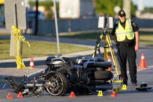 JOHN WOODS / WINNIPEG FREE PRESS
Police investigate at a MVC involving a car and a motorcycle at Inkster Blvd. and Inksbrook Drive Monday, June 12, 2017.