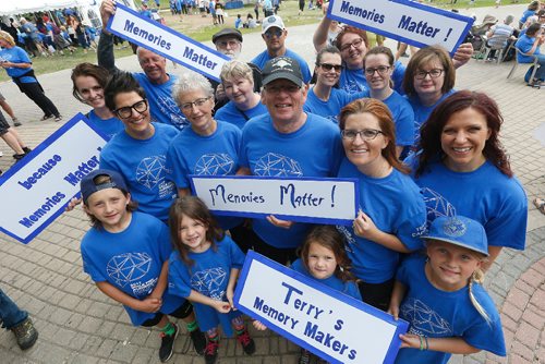 JOHN WOODS / WINNIPEG FREE PRESS
Terry and Jan Law (2nd row centre) are joined by their daughters, from left, Tara Liske, Kerri Pleskach and Christy Law, and family and friends at the Walk For Alzheimers at the Forks Tuesday, June 13, 2017.