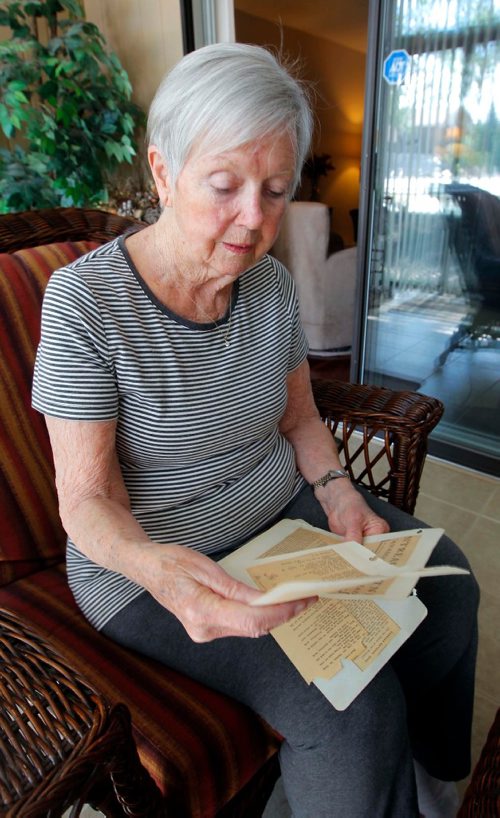 BORIS MINKEVICH / WINNIPEG FREE PRESS
150th anniversary of Canada. Jean Lothian from winnipeg has some old newspaper clippings for a Randy Turner story. Here she poses for shots of the articles. June 14, 2017
