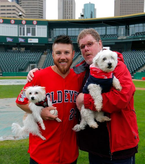 BORIS MINKEVICH / WINNIPEG FREE PRESS
Goldeyes at Shaw Park on Saturday are hosting the Bark in the Park game, wherein they are hoping to set a world record for the most dogs at a sporting event. From left, Goldeyes pitcher Edwin Carl holds his dog named Snooks poses with Doug Speirs and his dog Bogey. June 15, 2017
