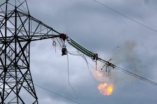 BORIS MINKEVICH / WINNIPEG FREE PRESS
Power lines for Manitoba Hydro Bipole III (3)  get installed near the transcanada Highway #1 and #12 Highway, near Dufresne, Manitoba. Here dynamite is used to fuse the insulators to the conductors. Kaboom!!June 15, 2017
