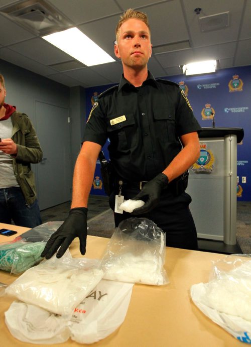 BORIS MINKEVICH / WINNIPEG FREE PRESS
POLICE PRESS CONFERENCE - Constable Jay Murray shows some crystal meth seized in a recent drug bust. June 16, 2017
