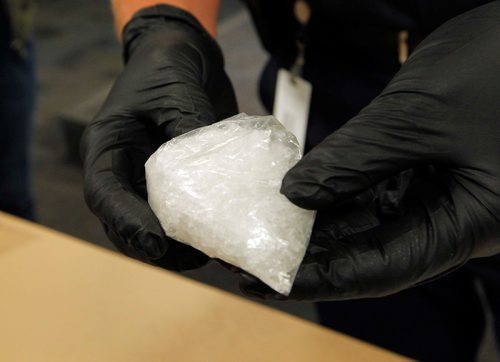 BORIS MINKEVICH / WINNIPEG FREE PRESS
POLICE PRESS CONFERENCE - Constable Jay Murray shows some crystal meth seized in a recent drug bust. June 16, 2017
