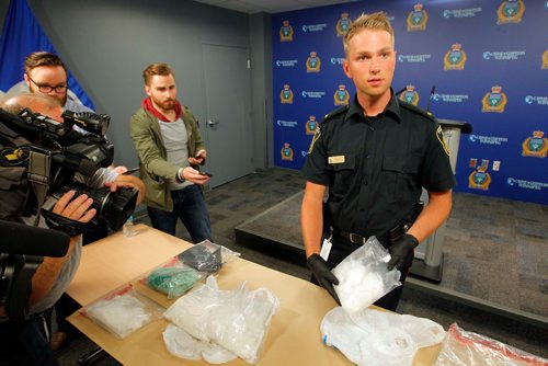 BORIS MINKEVICH / WINNIPEG FREE PRESS
POLICE PRESS CONFERENCE - Constable Jay Murray shows some crystal meth seized in a recent drug bust. June 16, 2017
