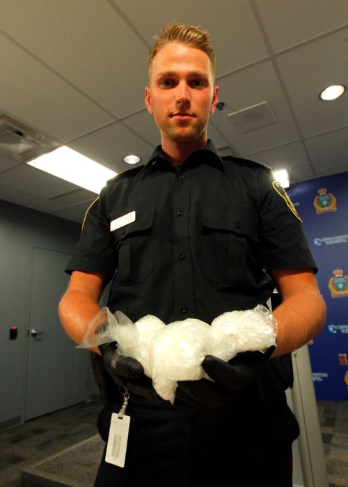 BORIS MINKEVICH / WINNIPEG FREE PRESS
POLICE PRESS CONFERENCE - Constable Jay Murray shows some crystal meth seized in a recent drug bust. June 16, 2017
