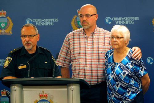 BORIS MINKEVICH / WINNIPEG FREE PRESS
POLICE PRESS CONFERENCE - From left, Constable Rob Carver with,  Rob Hadath (brother), and  Valerie Hadath (Scotts mom), the family of a missing 39-year-old man, at a Police press conference Friday morning. The missing man Scott Hadath was last seen on June 5 in the Southdale area of Winnipeg. June 16, 2017
