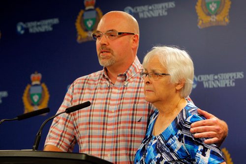 BORIS MINKEVICH / WINNIPEG FREE PRESS
POLICE PRESS CONFERENCE - The family of a missing 39-year-old man, from left,  Rob Hadath (brother) and  Valerie Hadath (Scotts mom) at a Police press conference Friday morning. The missing man Scott Hadath was last seen on June 5 in the Southdale area of Winnipeg. June 16, 2017
