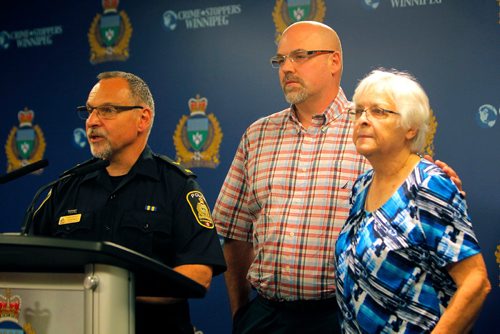 BORIS MINKEVICH / WINNIPEG FREE PRESS
POLICE PRESS CONFERENCE - From left, Constable Rob Carver with,  Rob Hadath (brother), and  Valerie Hadath (Scotts mom), the family of a missing 39-year-old man, at a Police press conference Friday morning. The missing man Scott Hadath was last seen on June 5 in the Southdale area of Winnipeg. June 16, 2017
