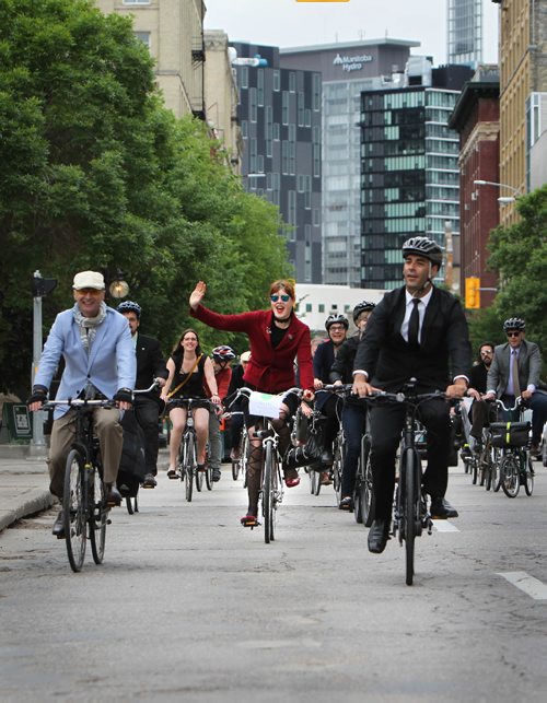 RUTH BONNEVILLE / WINNIPEG FREE PRESS

Members of City council, media personalities and bike enthusiasts take part in the 3rd annual Suit and Heels on Wheels ride as they head down King Street to city hall from the Forks dressed in their best Dress to launch the beginning of  Bike Week Friday.  

 
June 16, 2017