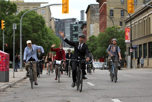 RUTH BONNEVILLE / WINNIPEG FREE PRESS

Members of City council, media personalities and bike enthusiasts take part in the 3rd annual Suit and Heels on Wheels ride as they head down King Street to city hall from the Forks dressed in their best Dress to launch the beginning of  Bike Week Friday.  

 
June 16, 2017