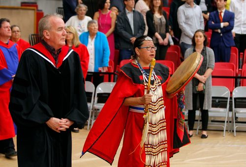 BORIS MINKEVICH / WINNIPEG FREE PRESS
U of W Convocation at Duckworth Centre. From left, Chair of Geography Marc Vachon walks along side of drummer Alison Cox during the opening of the event. June 16, 2017
