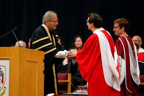 BORIS MINKEVICH / WINNIPEG FREE PRESS
U of W Convocation at Duckworth Centre. U of W Chancellor Robert Silver aids in giving Cindy Blackstock received an honorary doctor of Laws. June 16, 2017
