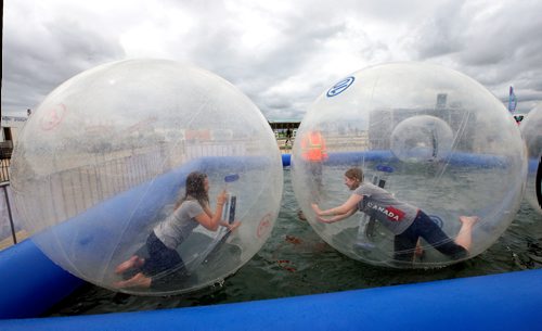 WAYNE GLOWACKI / WINNIPEG FREE PRESS

At left, Jessica Worb and Kit Muir in the Wobbly Water Balls on the opening day at The Ex at Red River Exhibition Park. Stefanie Lasuik story      June 16   2017