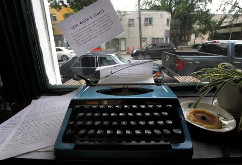 PHIL HOSSACK / WINNIPEG FREE PRESS  -  A "loaded" typewriter sits on a windowsill at Strong Badger Coffeehouse Friday. The machine invites patrons to write one sentence, all to be part of an upcoming book project. See Dave Sanderson's story.   -  June 16, 2017