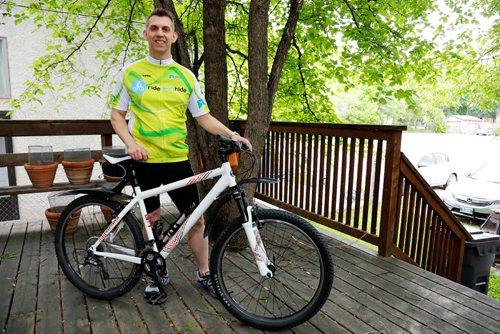 JUSTIN SAMANSKI-LANGILLE / WINNIPEG FREE PRESS
Sean Miller, 44, poses with his cycling gear outside his home Friday. Miller is a volunteer with the Mental Health Association's Ride Don't Hide event. This year's ride is June 25 at Vimy Ridge Park.
170616 - Friday, June 16, 2017.
