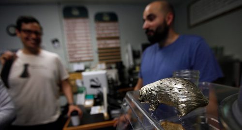 PHIL HOSSACK / WINNIPEG FREE PRESS  - Strong Badger Coffee features many "badgers in print and sculpture scattered around the shop.This one though, is a hedge hog imersonating a badger on a display case.   -  June 16, 2017