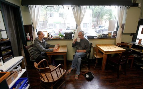 PHIL HOSSACK / WINNIPEG FREE PRESS  - Strong Badger Coffee patrons Dave Nishikawa (left) and Mark Somers get down to the business of coffee.   -  June 16, 2017