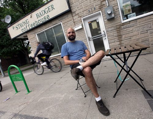 PHIL HOSSACK / WINNIPEG FREE PRESS  - Strong Badger Coffee owner Brock Peters poses outside his coffee shop/bookstore/gathering place.   -  June 16, 2017