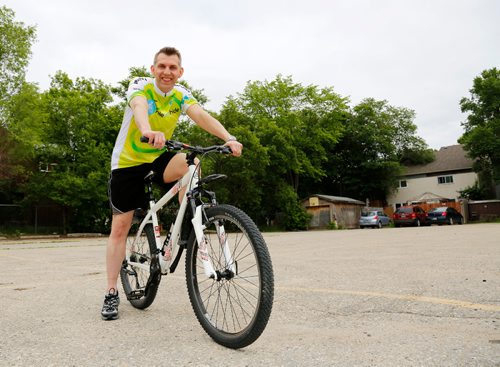 JUSTIN SAMANSKI-LANGILLE / WINNIPEG FREE PRESS
Sean Miller, 44, poses with his cycling gear outside his home Friday. Miller is a volunteer with the Mental Health Association's Ride Don't Hide event. This year's ride is June 25 at Vimy Ridge Park.
170616 - Friday, June 16, 2017.